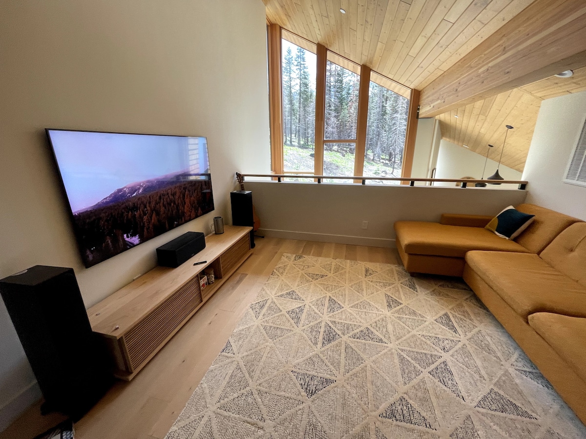 Loft with large TV overlooking living room