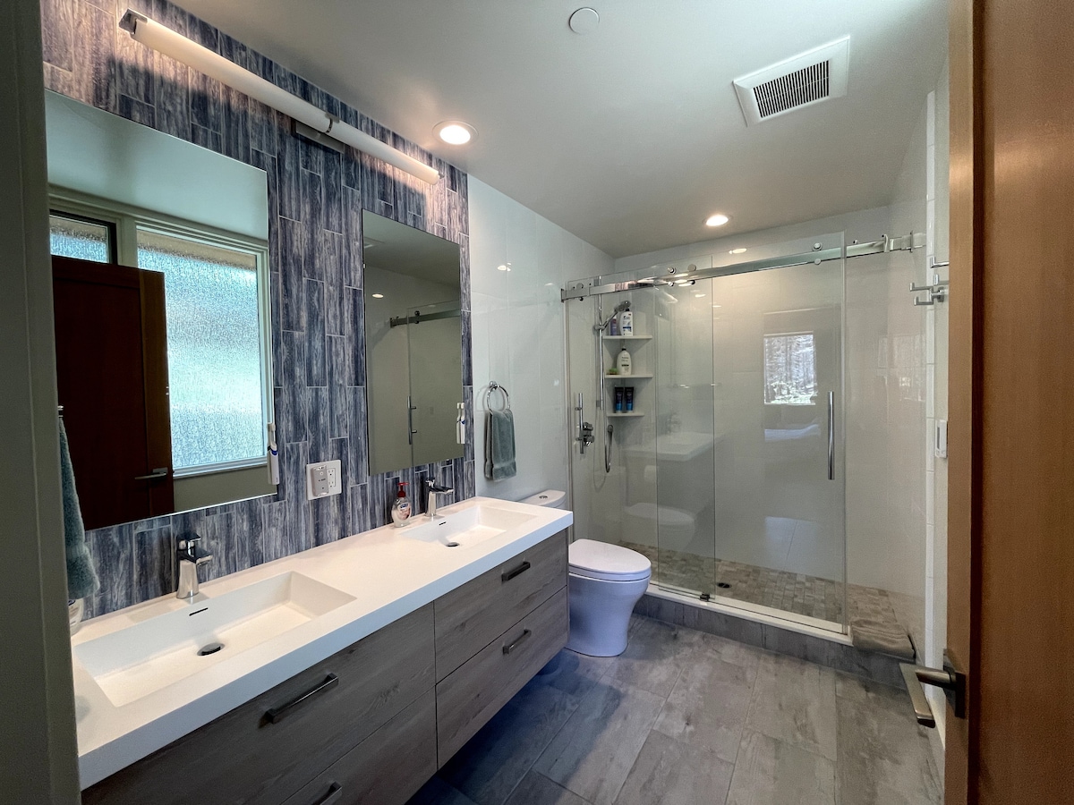 Master bathroom with walk-in shower and double vanity