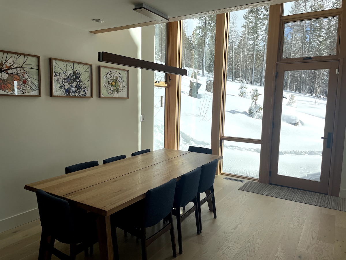 Dining area with expansive floor-to-ceiling windows