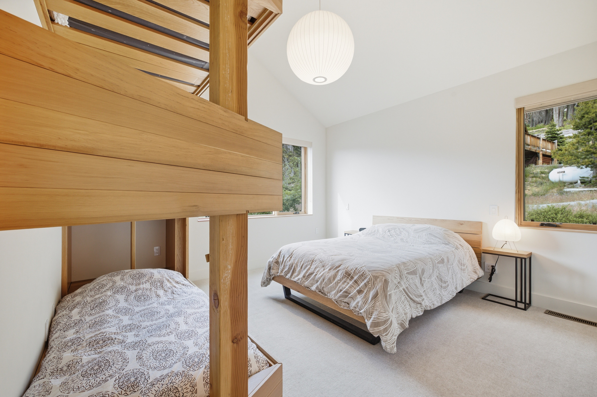 Bunk room with custom bunk beds and queen bed