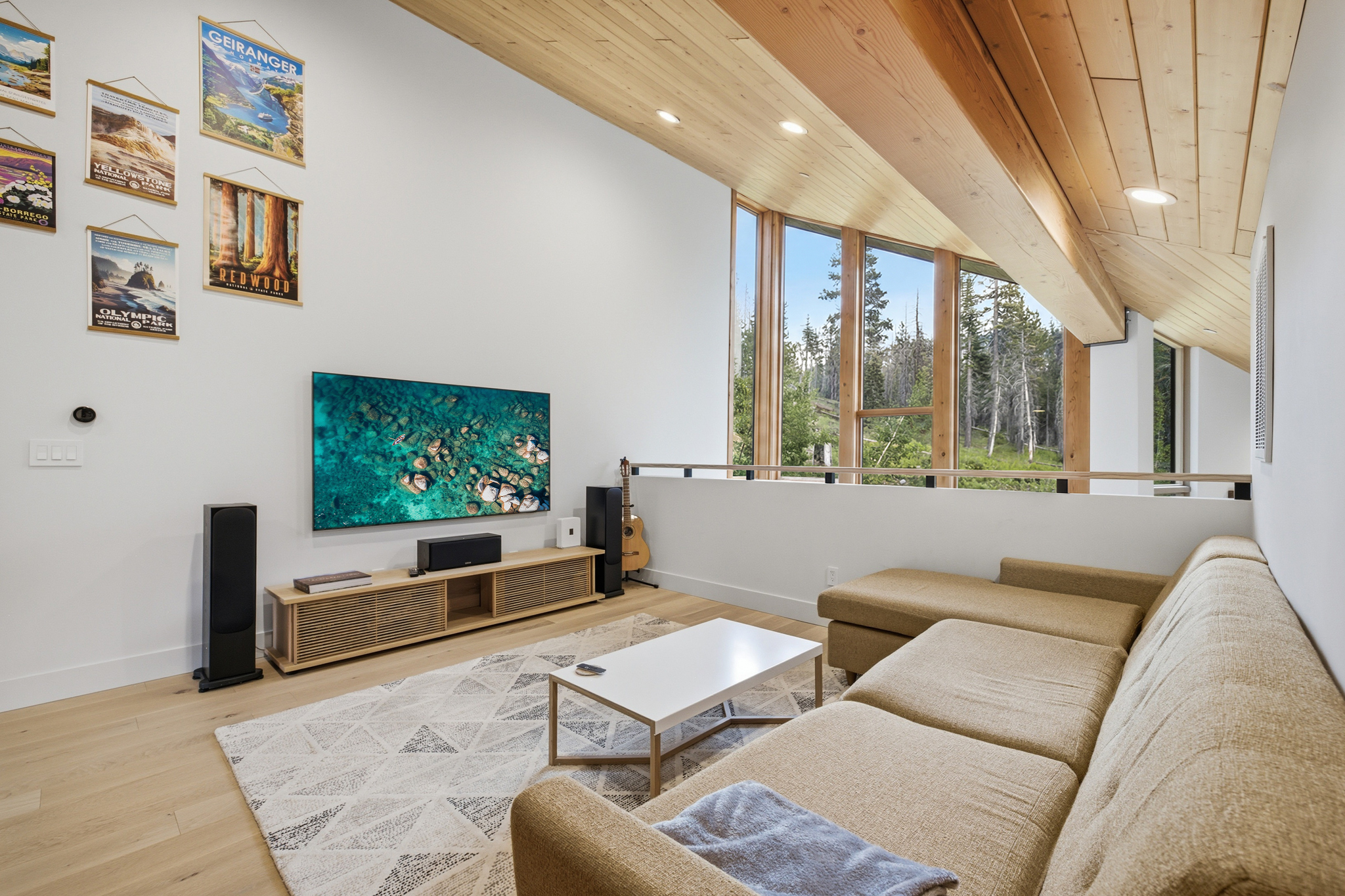 Loft lounge with National Park poster wall and large TV
