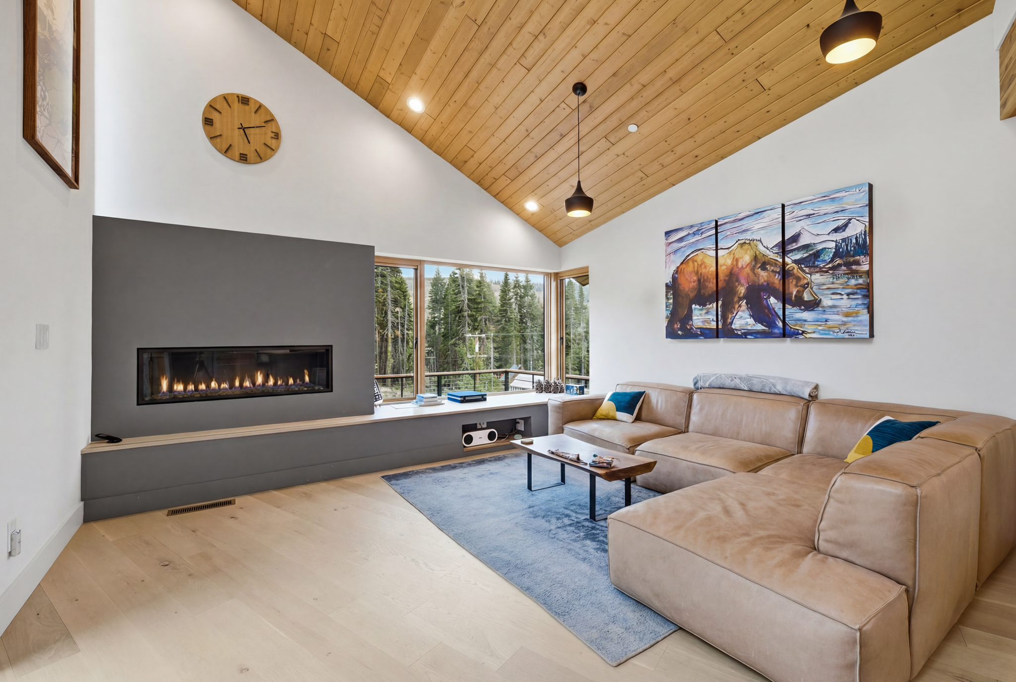 Living room fireplace centered with sectional sofa