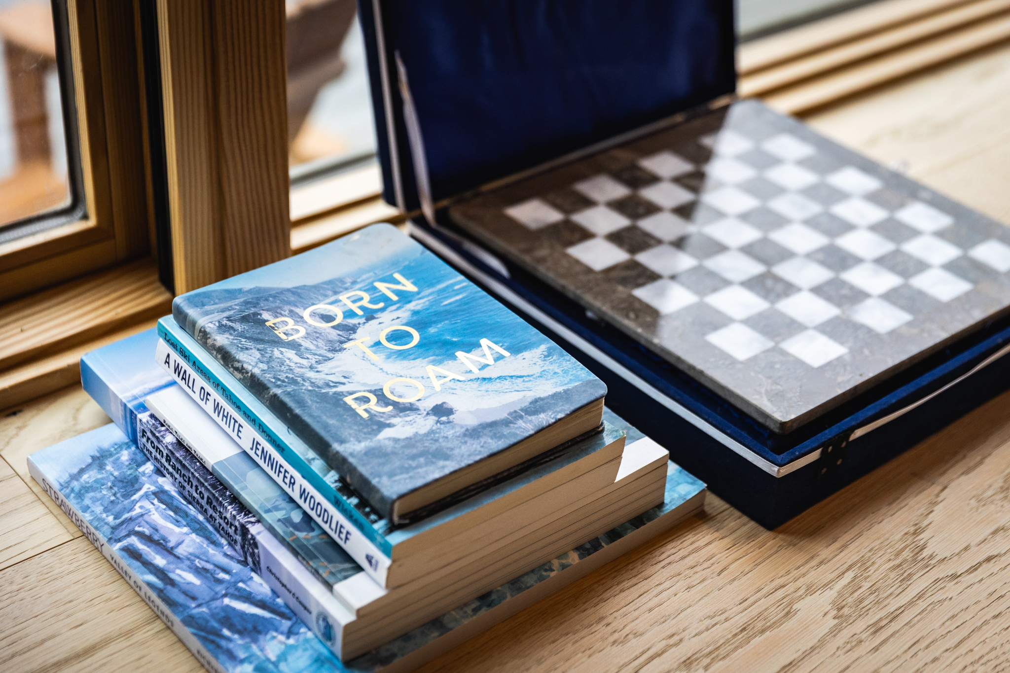 Books and chess set on windowsill